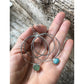 Wax and Wane Pendulum Hoops with Larimar and Sea Glass Shown in Hand
